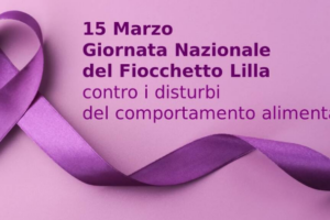 Lotta contro i disturbi del comportamento alimentare: mura di Como illuminate di lilla