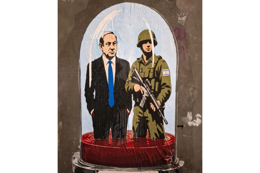Netanyahu e un soldato con le gambe affondate nel sangue